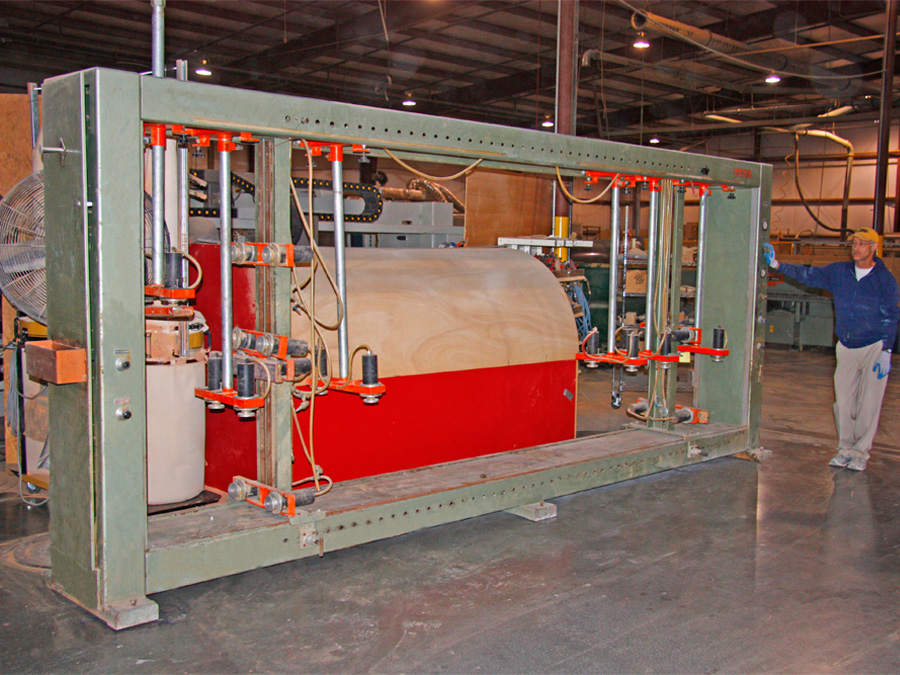 Holz Her 1528 Case Clamp: This is a 15' long x 6' tall dual zone case clamp for rapid assembly of case goods. We can assemble 2 cabinets at a time on this single clamp. When utilized with the Morbidelli U550 we can make hundreds of cabinets in a single day.