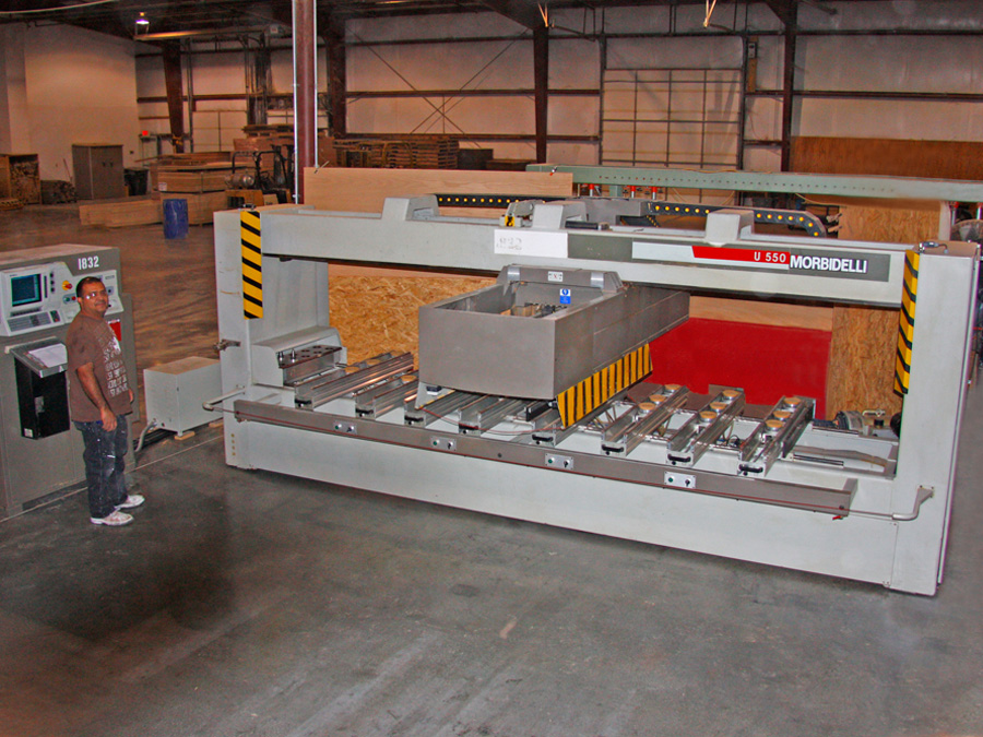 Morbidelli U550 Point-to-Point: This is a CNC router and boring machine like no other. With it we can size and shape panels with 2 routers heads as well as a 4th axis saw unit. Once cut to size we can do gang boring utilizing (30) 32mm vertical and (10) horizontal boring banks. This machine has the ability to figure out and automatically cut left and right cabinet sides at the same time. When making cabinet sides this machine is the machine of choice. It can make 4 sides in the time it takes the Thermwood Model 42 Router to make 1.