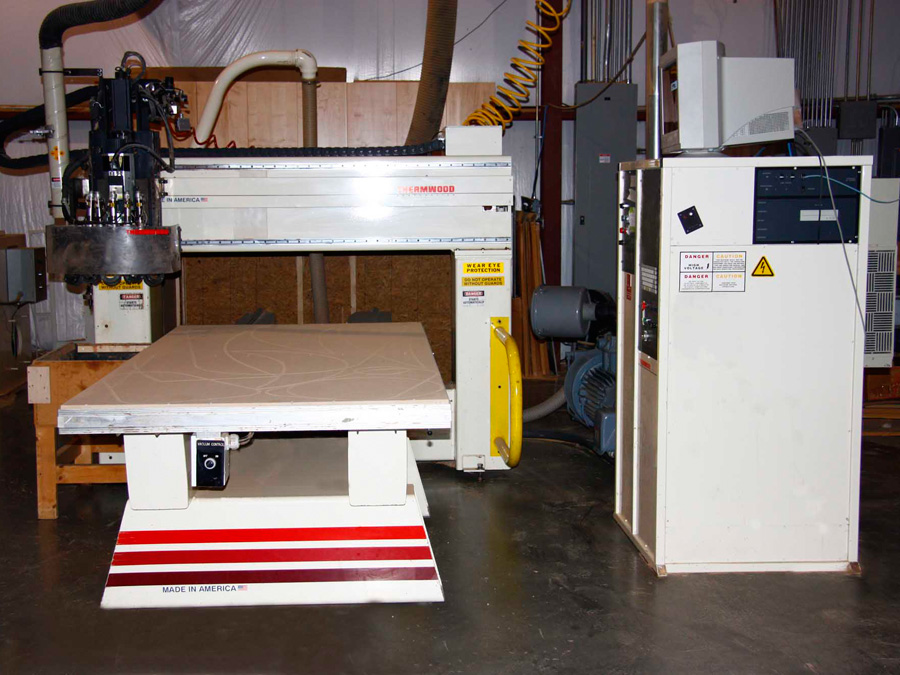 Thermwood Model 40 CNC Router: This is a 4' x 8' machine that has a 5 position, head mounted typewriter tool changer designed for extremely fast tool changes to insure maximum performance. This machine also utilizes an aggregate tool holder for horizontal boring, sawing and profiling for v-groove and bead board panels.